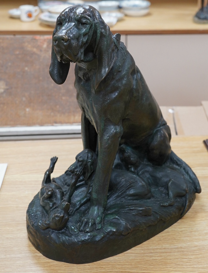 After Prosper Lecourtier (1855-1924), bronze model of a seated bloodhound and puppies, signed, 40cm tall. Condition - fair to good